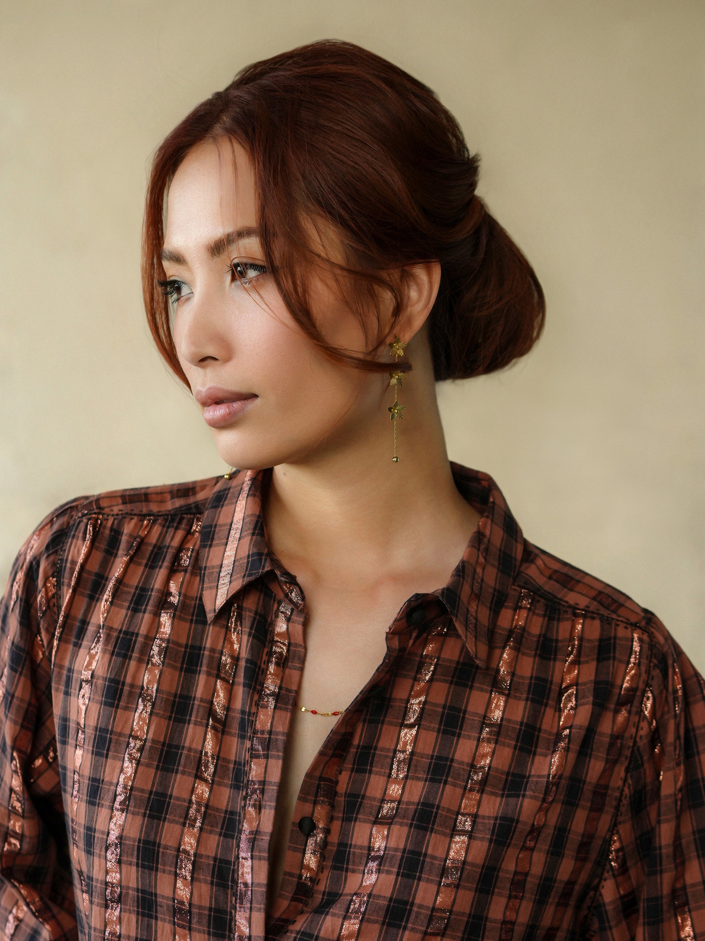 woman wearing birkin blouse rust